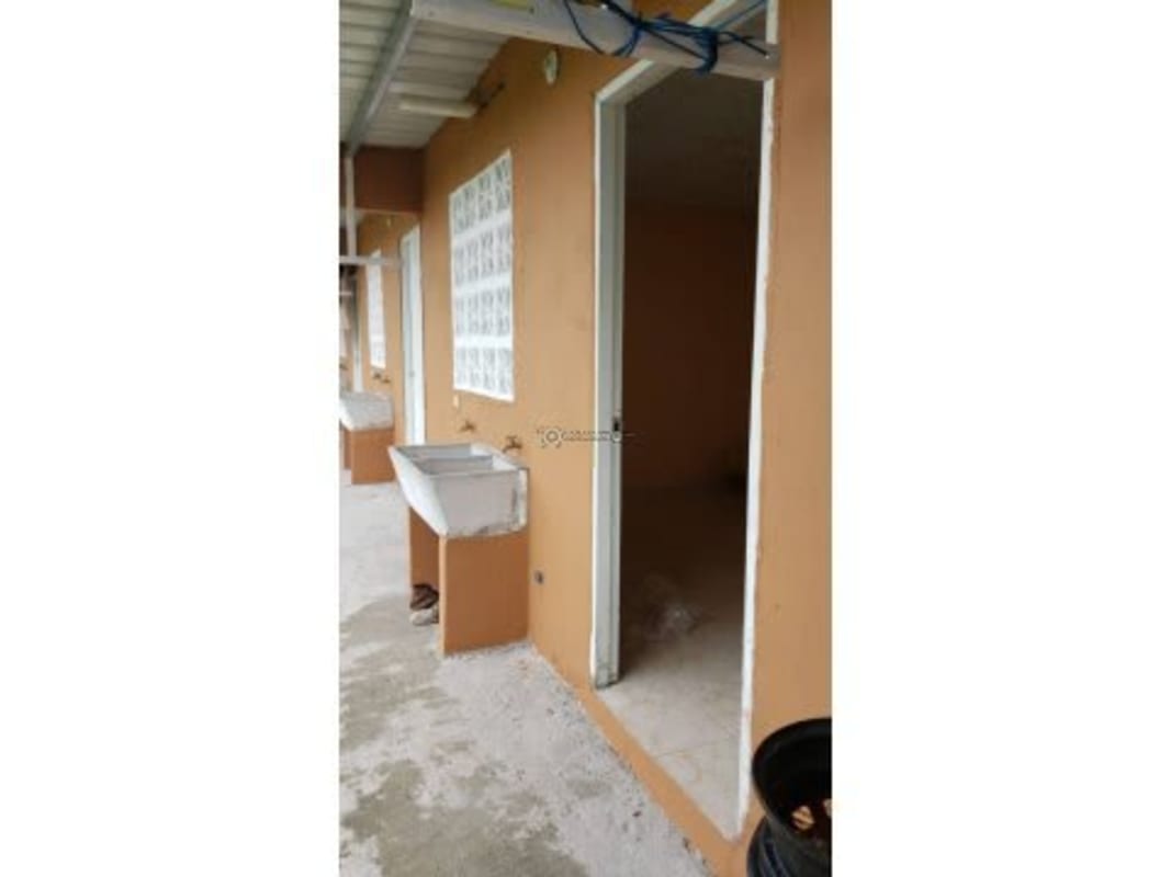 Unfurnished empty room with beige tile floor and doorway in budget apartment Brisas de Tocumen Panama