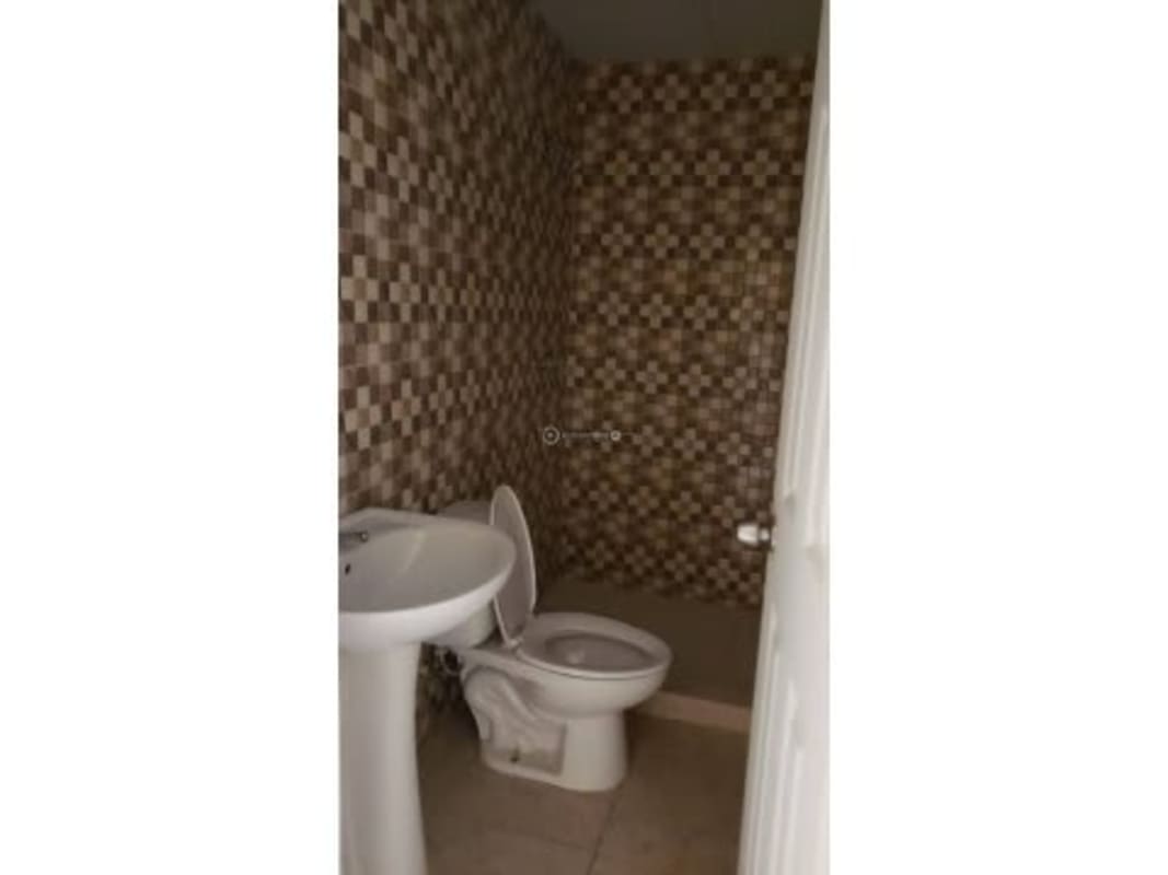 Kitchen with black countertop and mosaic tile backsplash in 1 bedroom apartment Brisas de Tocumen Panama for rent