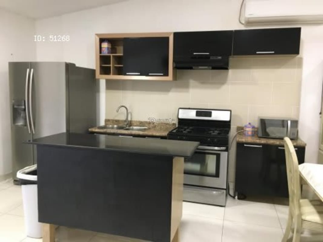Open kitchen with granite counters, stove, fridge, microwave PH Residencial La Loma Panama City