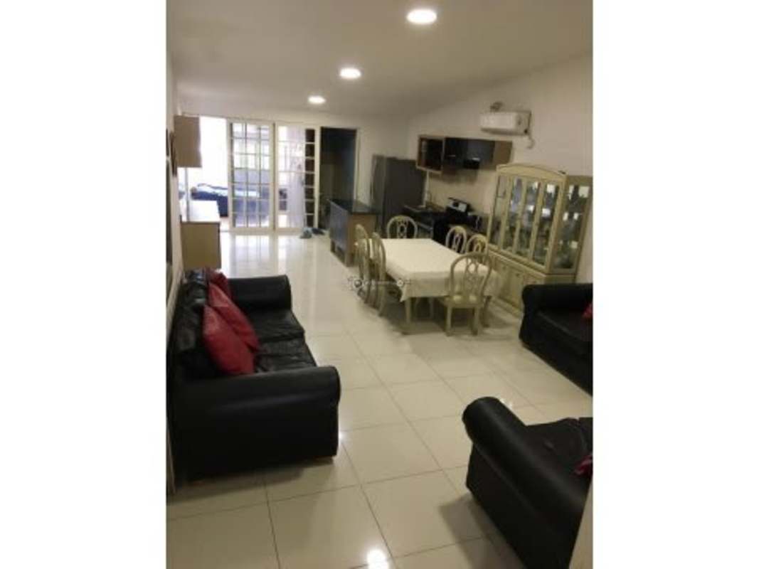 Modern kitchen with black cabinetry and granite countertops in Panama apartment rental