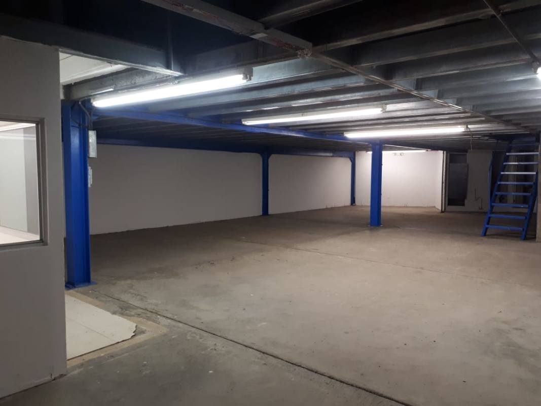 Open unfinished storage basement with exposed ceiling, fluorescent lighting on Vía España Panama