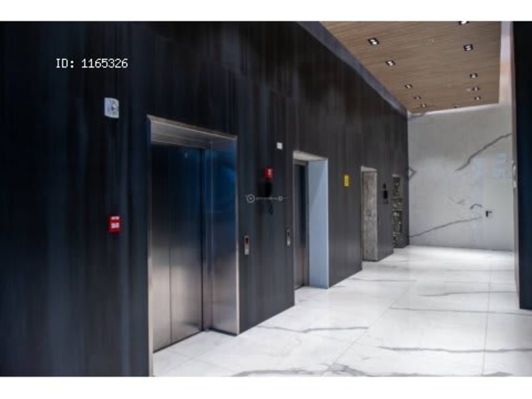 Interior parking garage illuminated with vibrant wall graphics Dorado City Center Panama