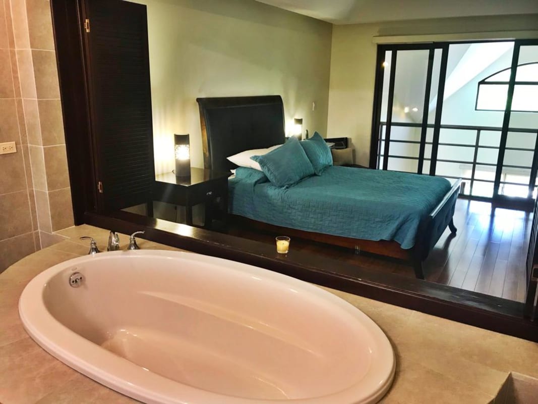 Mezzanine loft bedroom suite with wood floors Embassy Club Clayton Panama