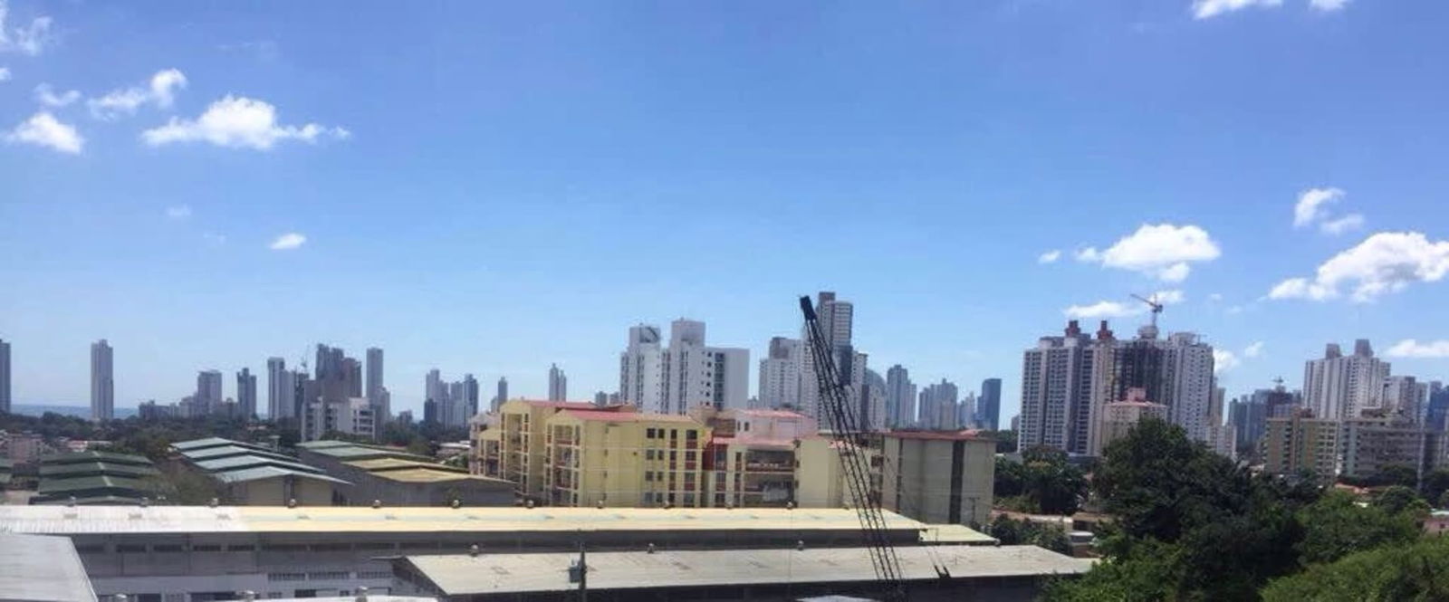 Skyline with high-rise buildings and blue sky as seen from Rio Abajo land for sale