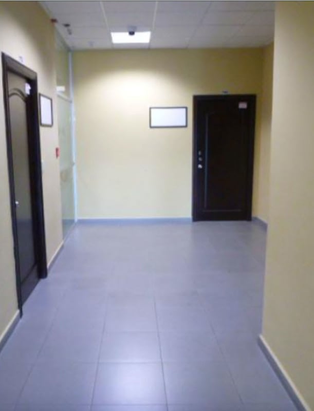 Modern clean hallway with security camera and glass partitions PH Morica Panama City