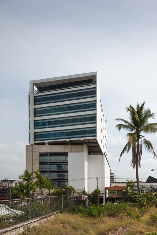 Glass facade office tower with palm and landscaping PH Morica Calle 50 Panama