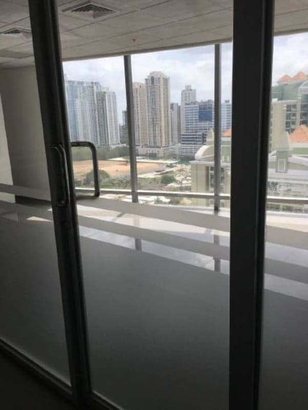 Office interior panoramic window view Torre Aseguradora Ancón Costa del Este Panama