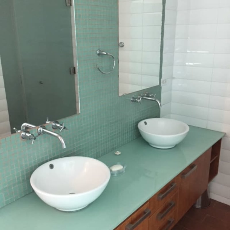 Modern loft apartment with double-height ceilings and spiral staircase at PH Loft 41 Panama