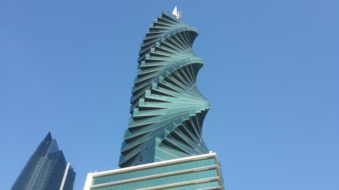 Striking turquoise twisted Revolution Tower skyscraper exterior in Panama City