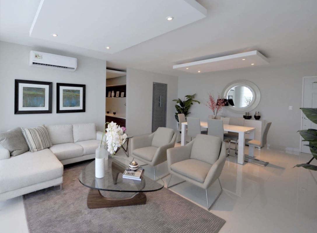 Modern kitchen with granite countertops, stainless appliances light wood cabinets in Mei Tower Panama