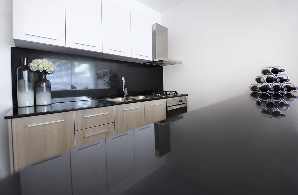 Spacious apartment bedroom with built-in closet tufted headboard PH MiCondado Panama City