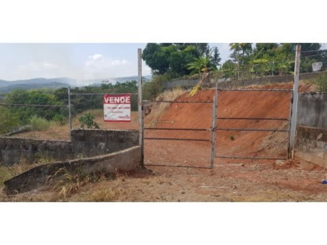 Entrance gate of fenced 1,800 m² leveled land lot with mountain view in Altos de Tocumen Panama City