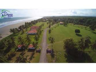 Aerial photograph of beach project with Pacific Ocean, tropical palms and sandy coastline in Panama