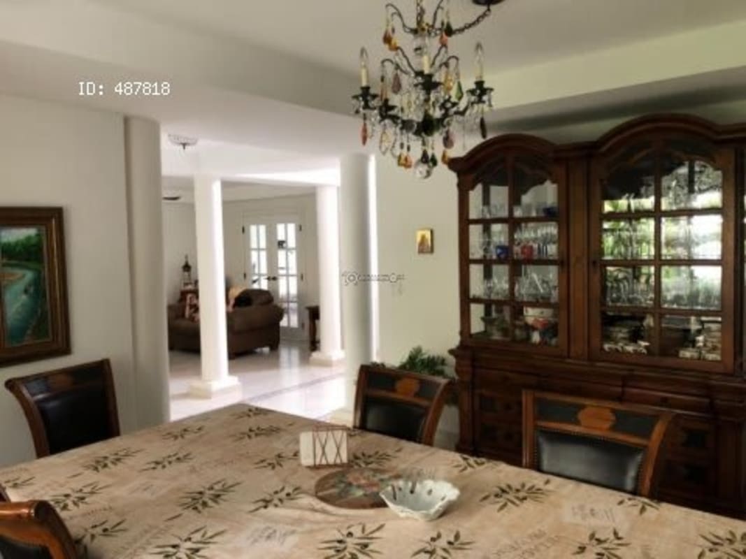 Elegant dining room with chandelier, china cabinet and traditional decor in Costa Serena Panama
