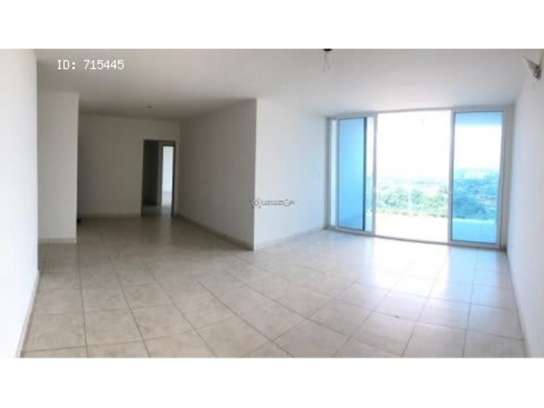 Bright living room large sliding doors access balcony in PH Villa de las Fuentes Panama City