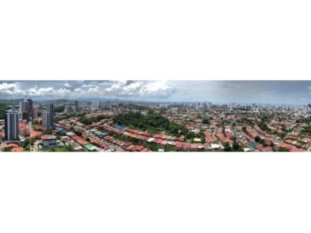 Modern high-rise condominium with pool and city skyline at PH Villa de las Fuentes Panama