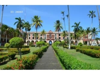 Historic ballroom with high ceilings, chandeliers, marble floors at Hotel Washington Colón Panama
