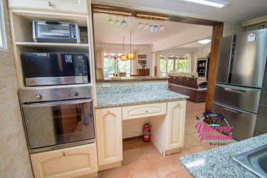 Open dining space with ceramic floors, natural light at golf villa Costa Blanca Decameron Panama for rent