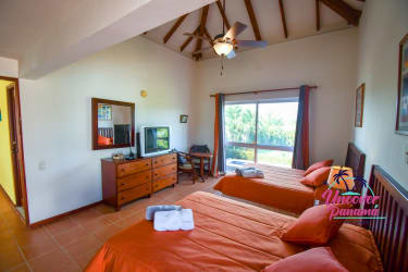 Spacious master bedroom with king bed and ensuite bath in Costa Blanca Golf Resort