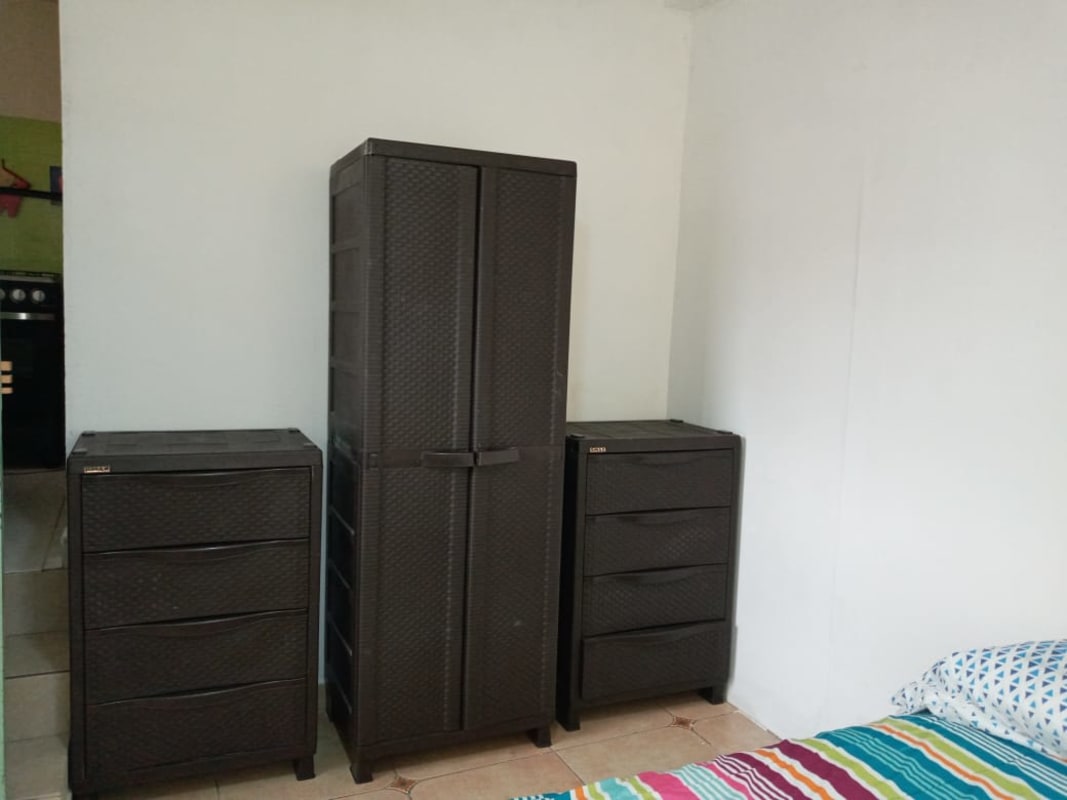 In-unit laundry with washer and dryer featured in affordable furnished rental Panama City