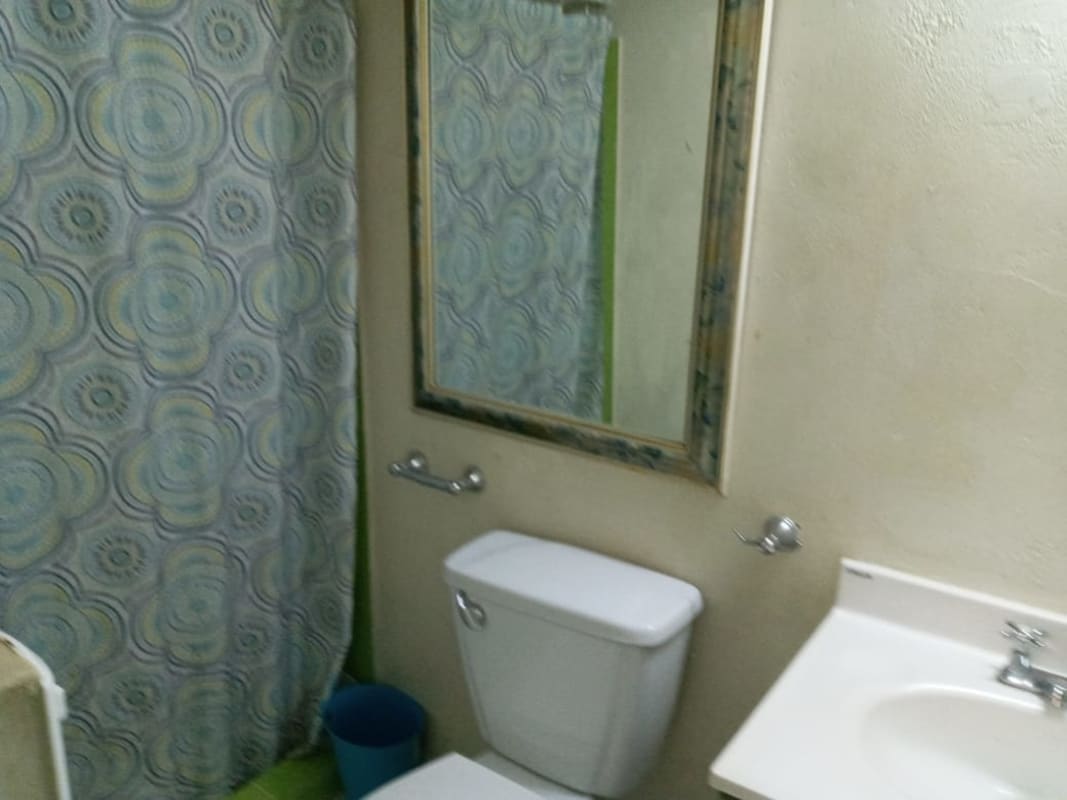 Bathroom with shower, sink, toilet in furnished studio apartment for rent in Hato Pintado Panama City