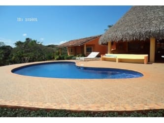 Palapa lounge with hammock, sofa, and bar counter tropical vacation property near beach Pedasi Panama