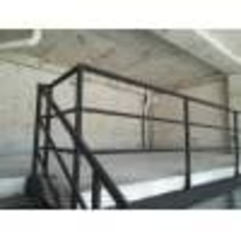 Exterior parking lot and retail stores at Galerías Panamericana Las Mañanitas Panama