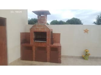 Beach house exterior Mediterranean style tile roof and front garden in PH Fontanella del Mar San Carlos Panama