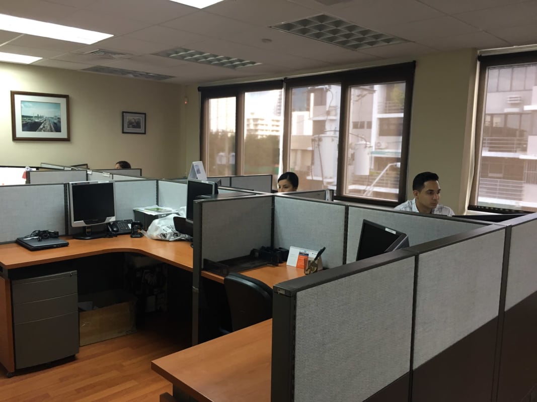 Open-plan office area with cubicles and large windows at PH Eurocentro Obarrio Panama