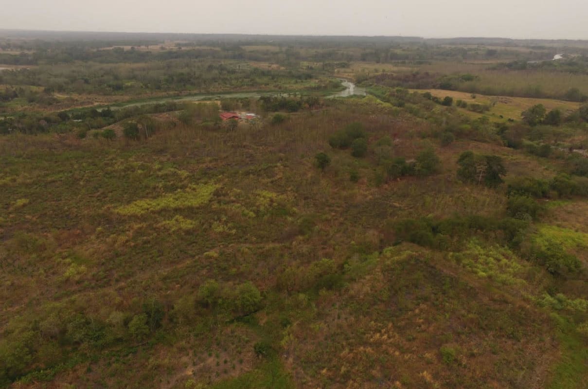 Panoramic aerial with river, forest and open fields Pacora Panama