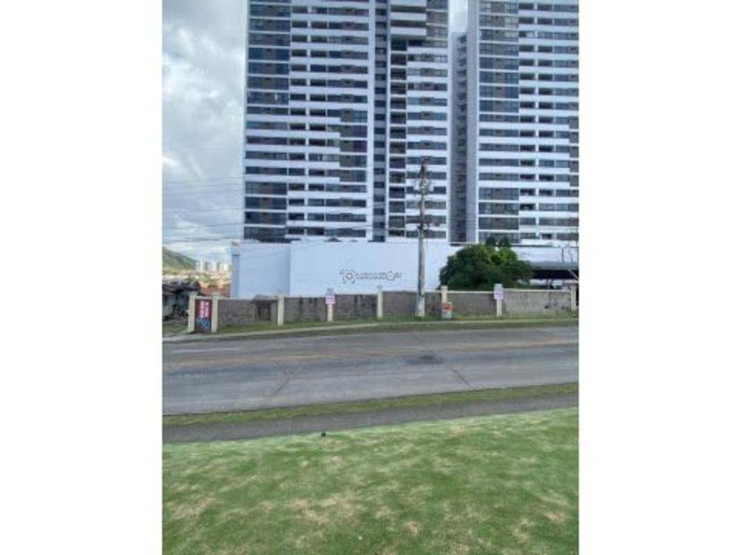 View from lot with residential towers nearby illustrating development potential Condado del Rey Panama
