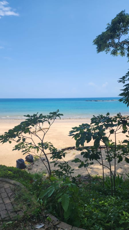Panoramic ocean view of sandy beach and turquoise water from private Saboga Island villa