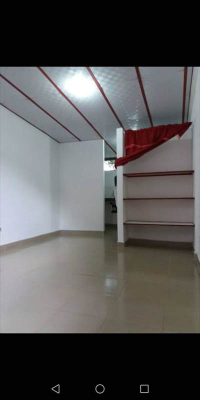 Empty bedroom space with tile flooring and white walls in affordable studio apartment near Metro Panama