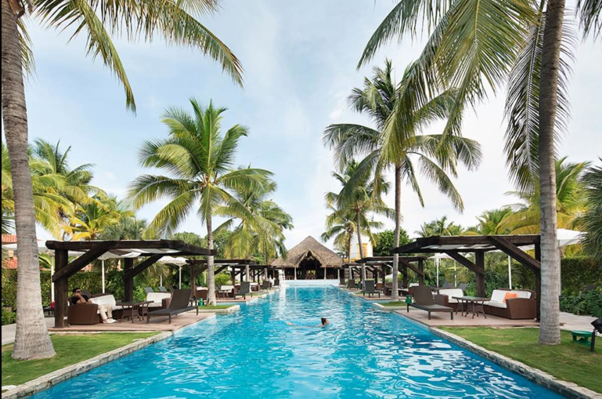 Elegant Mediterranean pool area with tropical landscaping at luxury beachfront villa Buenaventura Panama