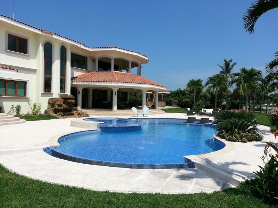 Mediterranean mansion with tropical garden, curved swimming pool and beachfront Buenaventura Panama