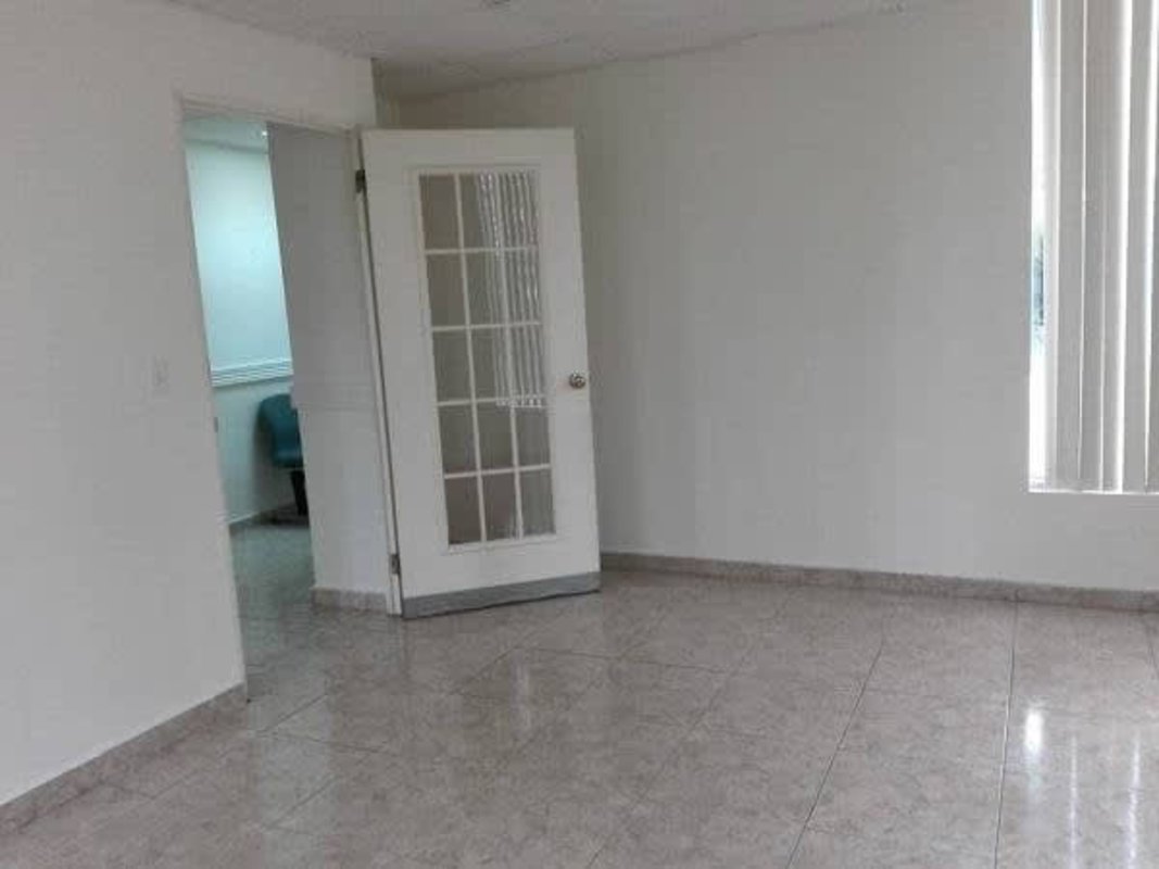 Functional office bathroom with sink, vanity, toilet at PH Plaza Ejecutiva Panama City