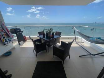 Open kitchen with granite breakfast bar in oceanfront condo PH Biltmore Playa Gorgona Panama