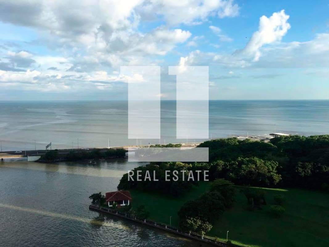 Infinity pool by lush gardens overlooking ocean at PH Panamar Coco del Mar Panama