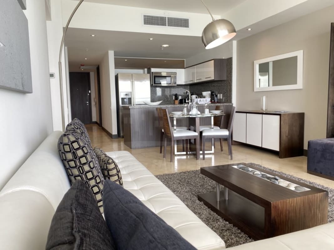 Master bedroom with ocean views, balcony access, king bed at JW Marriott Panama apartment for rent