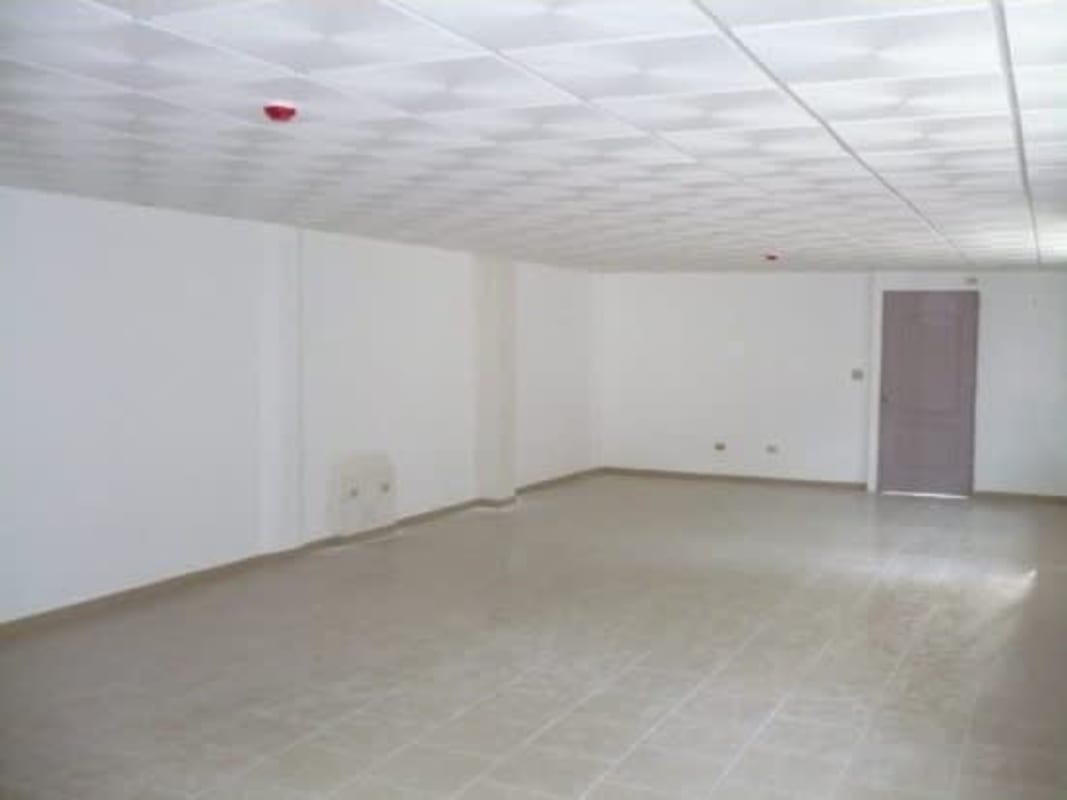 Empty interior room with tile floors and drop ceiling ideal for office in Tocumen industrial warehouse