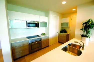 Open kitchen with granite and modern cabinetry at PH Casa Bonita Playa Bonita Panama