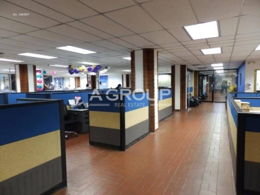 Spacious office area with cubicles and reception at commercial warehouse site, Panama City
