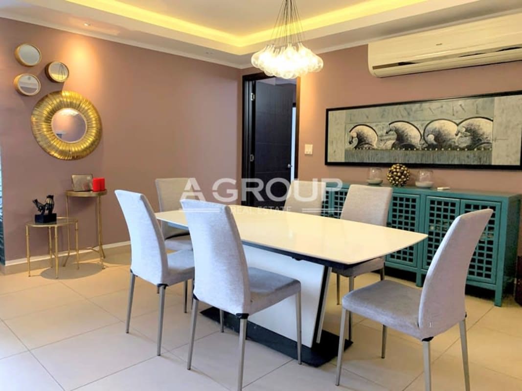 Dining room with designer lighting, mirror accents, modern furnishings at PH Country Club Costa del Este Panama