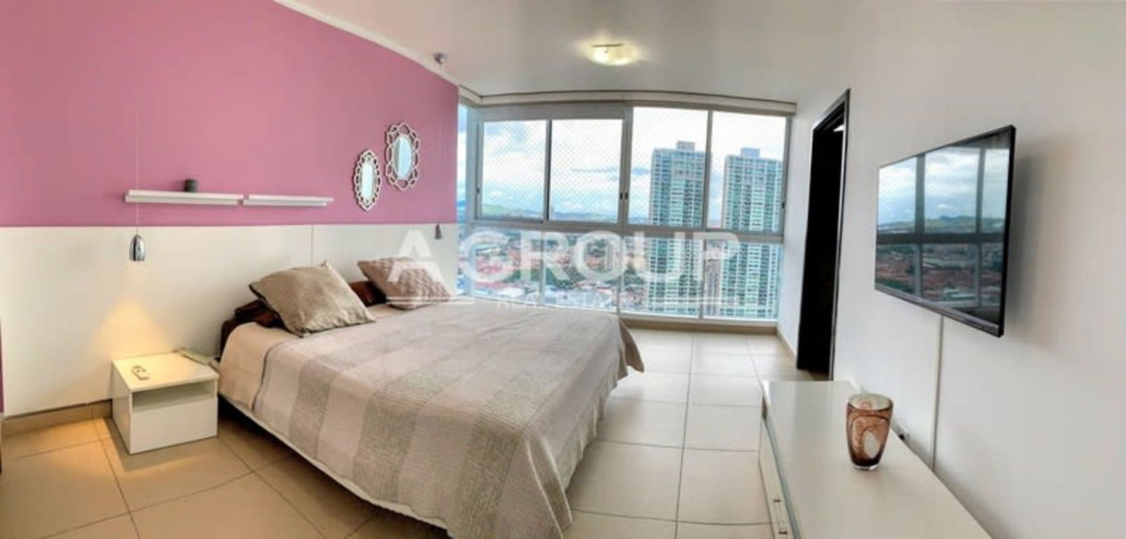 Guest bedroom with textured accent wall and twin beds PH Country Club Costa del Este Panama