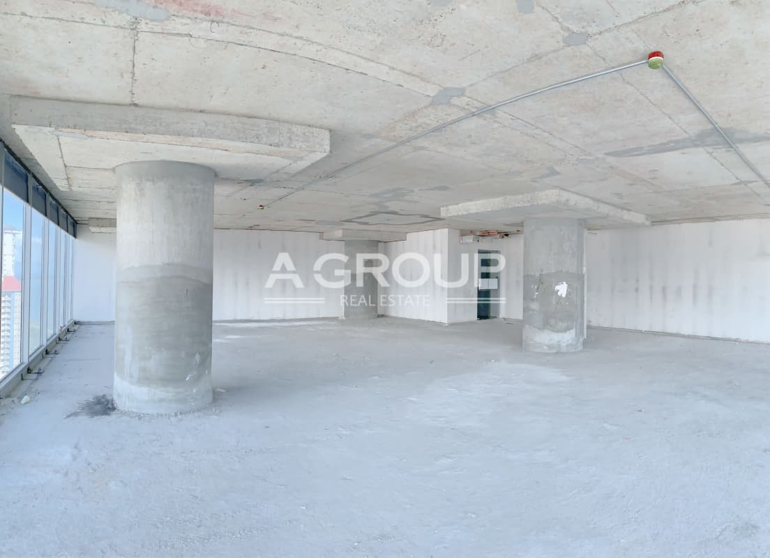 Large raw commercial office shell with concrete floors, columns and ocean view windows in Oceania Tower 2000 Panama