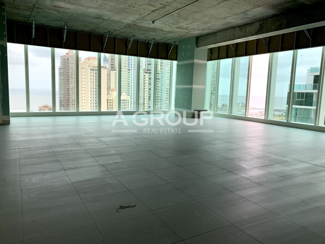 Unfinished open-plan office with panoramic city skyline ocean views Pacific Center Panama