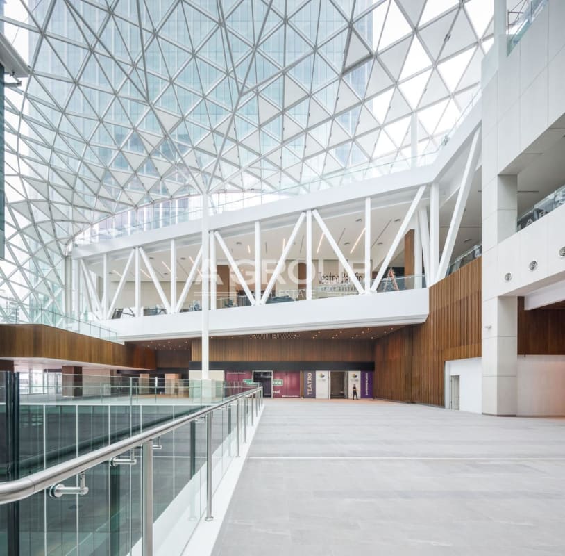 Modern commercial atrium with skylight and escalators in Pacific Center Punta Paitilla Panama