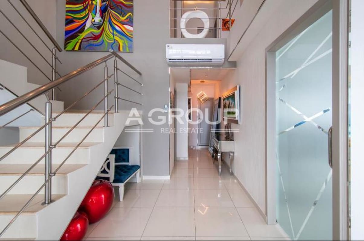 Contemporary loft with open staircase and ocean views in Icon Tower penthouse Panama