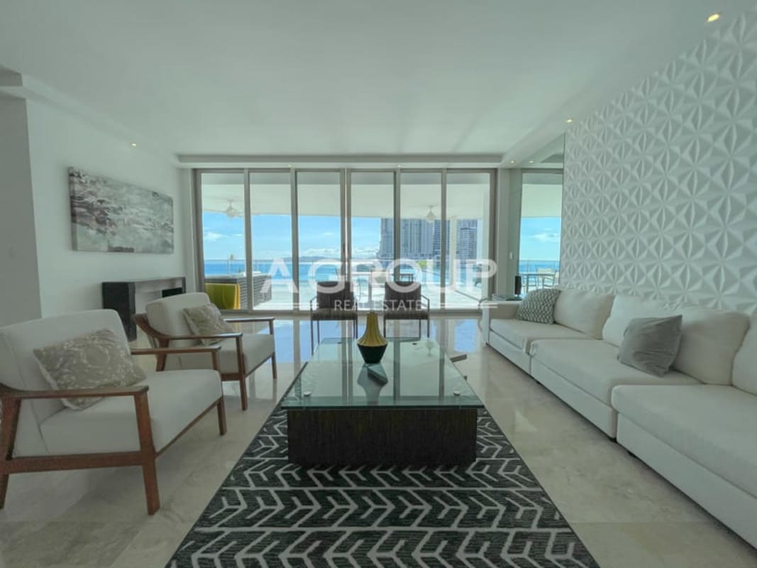 Spacious kitchen with granite countertops, island, and ocean views in PH Aqualina