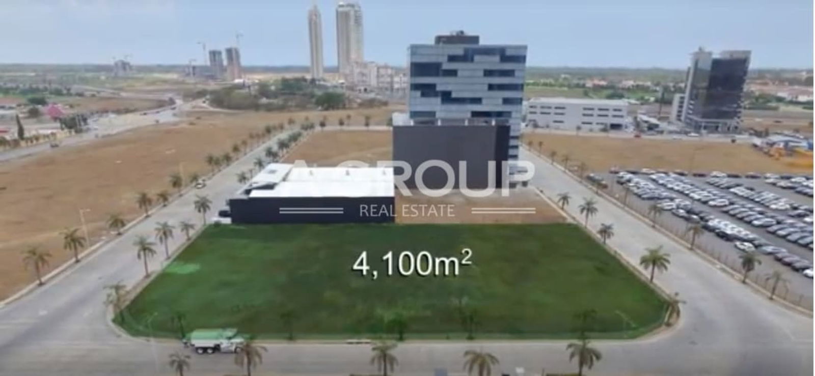 Empty flat land plot for sale surrounded by office buildings at Santa María Panama